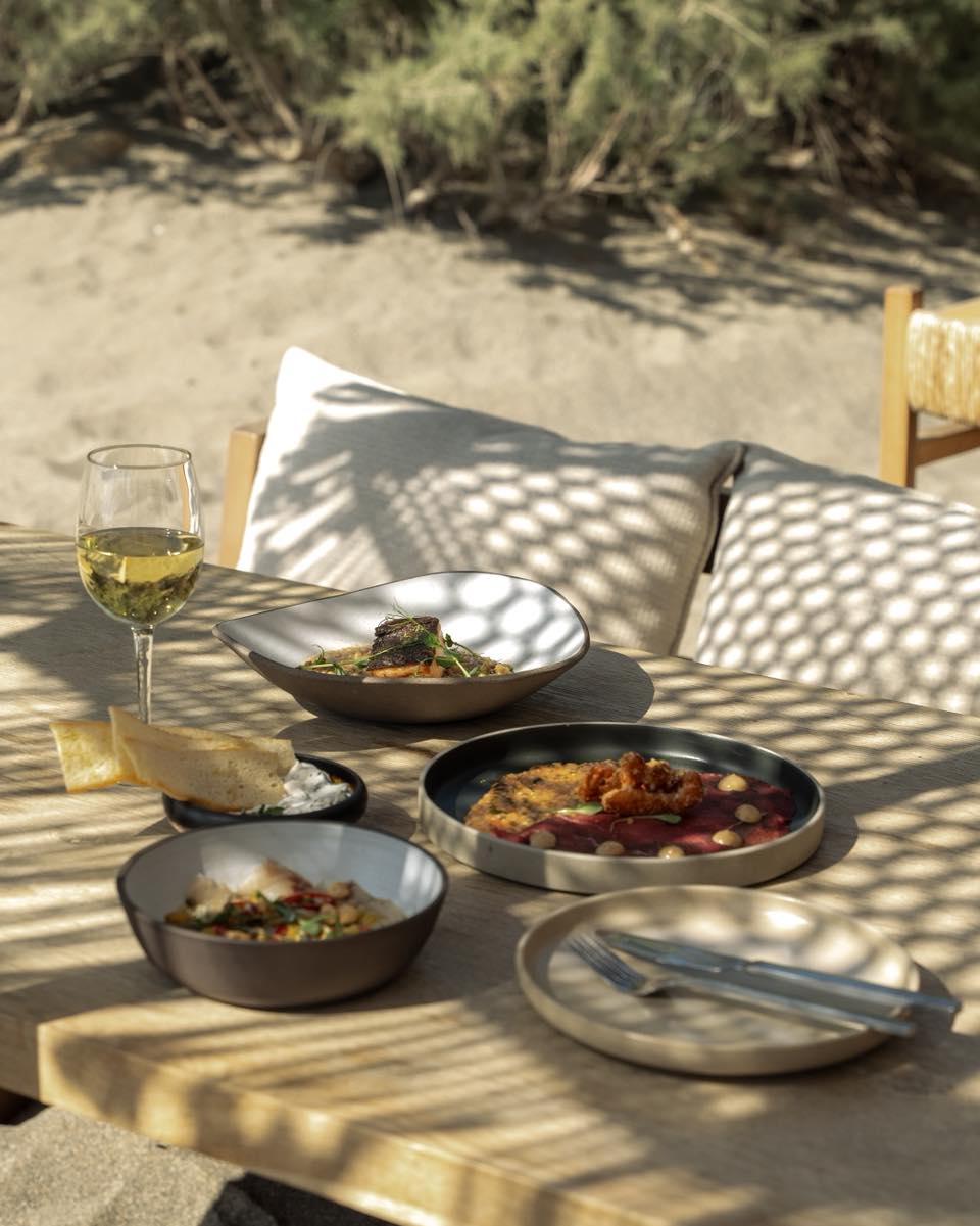 Midday beach table under an umbrella