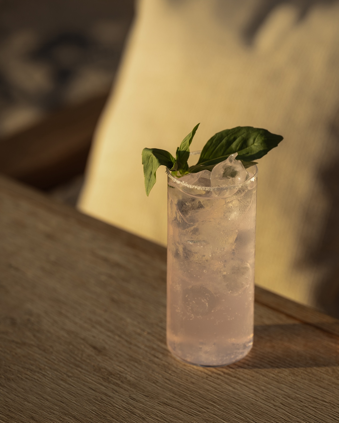 Pink cocktail on a wooden table