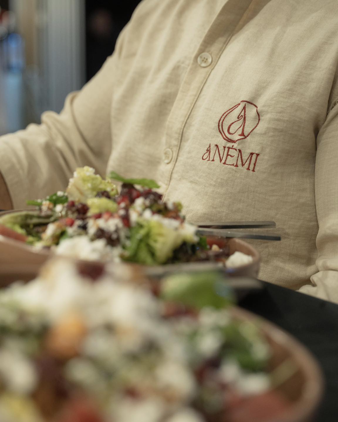 Staff serving a fresh salad
